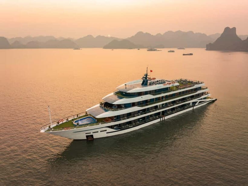 2-Day or 3-Day: Halong&Lan Ha Bay Cruise 5<em> balcony,bathtub – Tuan Chau Harbor to Tra Bau in Lan Ha: Your First Real Taste of the Bay’ /><br />
Most of your Day 1 energy is about getting onto the water fast and hitting the Bay’s most famous limestone feel early. You’ll be picked up from Hanoi if you choose the limousine transfer option, then you arrive at Tuan Chau Harbor and transfer to the ship. Once onboard, you do the usual welcome drink, meet the captain and crew, and get safety guidelines before lunch.</p>
<p><p>Then comes Tra Bau, tied to that Kong Skull Island movie location vibe. The point of Tra Bau is simple: it’s your first stretch of <strong>kayaking and swimming</strong> in calmer water near the limestone. You can kayak or just swim, and there’s also a Jacuzzi available on the ship (located on the 2nd level), which is a nice option if you want “water time” without living in the sun.</p>
</p>
<p><p>Here’s the honest consideration: swimming logistics can vary. The plan includes swimming at Tra Bau and later around hidden islands, but sometimes you may swim from the boat rather than from a perfectly sandy beach. If you know you only want beachy swimming, ask ahead how your sailing handles swimming stops on the day you go—weather and tide can change what’s practical.</p>
</p>
<h2 id="sunset-party-cooking-class-and-night-activities-that-keep-the-mood-light">Sunset Party, Cooking Class, and Night Activities That Keep the Mood Light</h2>
<p><img src=