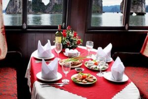 Halong 6 hours Boat tour with Cave, Kayak, lunch, transfer high-way from Hanoi - First views from the cruise: Halong symbol rock and onboard lunch