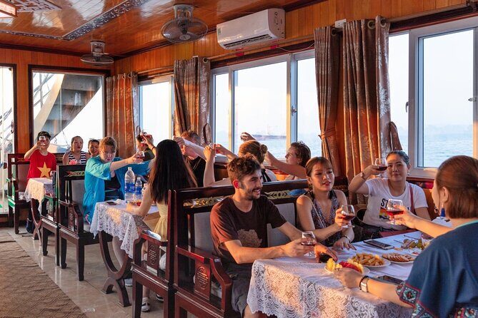 Halong Bay Day Tour With Titop Island, Cave, Kayak & Lunch - Luon Cave area kayaking or bamboo boat rowing